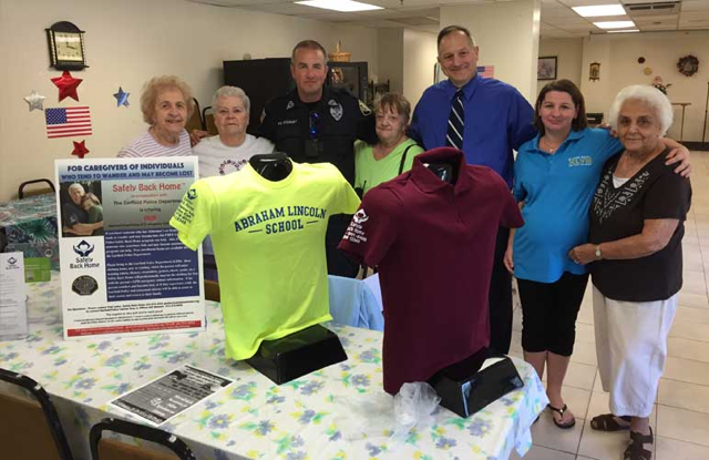 Garfield, NJ Officer Jeff Stewart at the Garfield Senior Center with Safely Back Home.